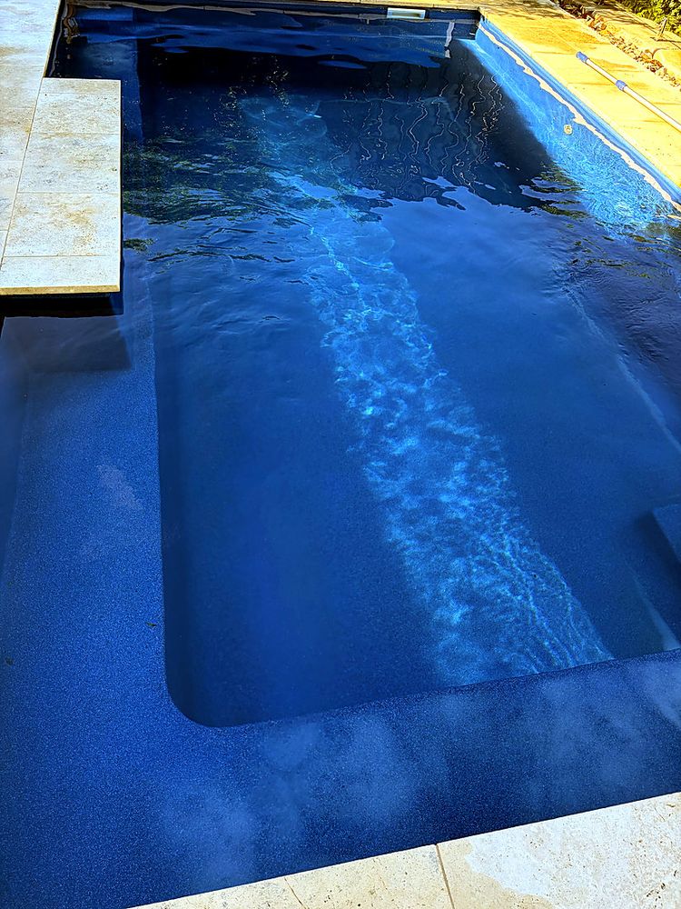 Rectangular pool with a deep blue finish