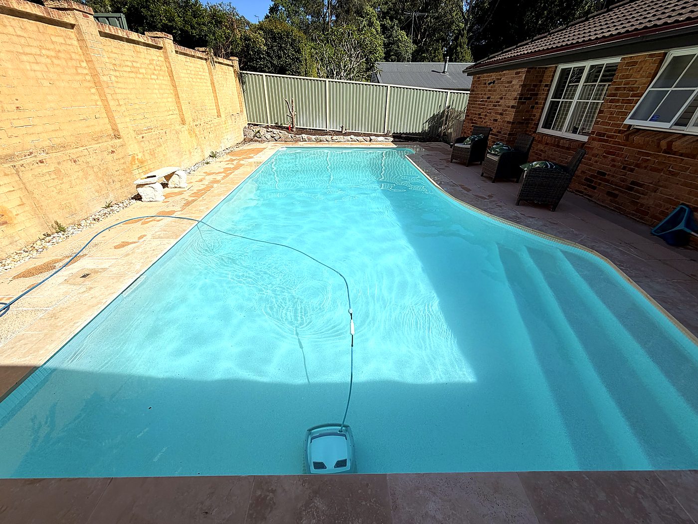Crystal clear pool with travertine surrounds