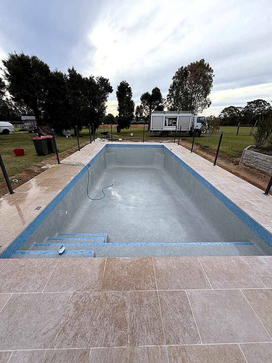 New pebble interior with blue mosaic step edges